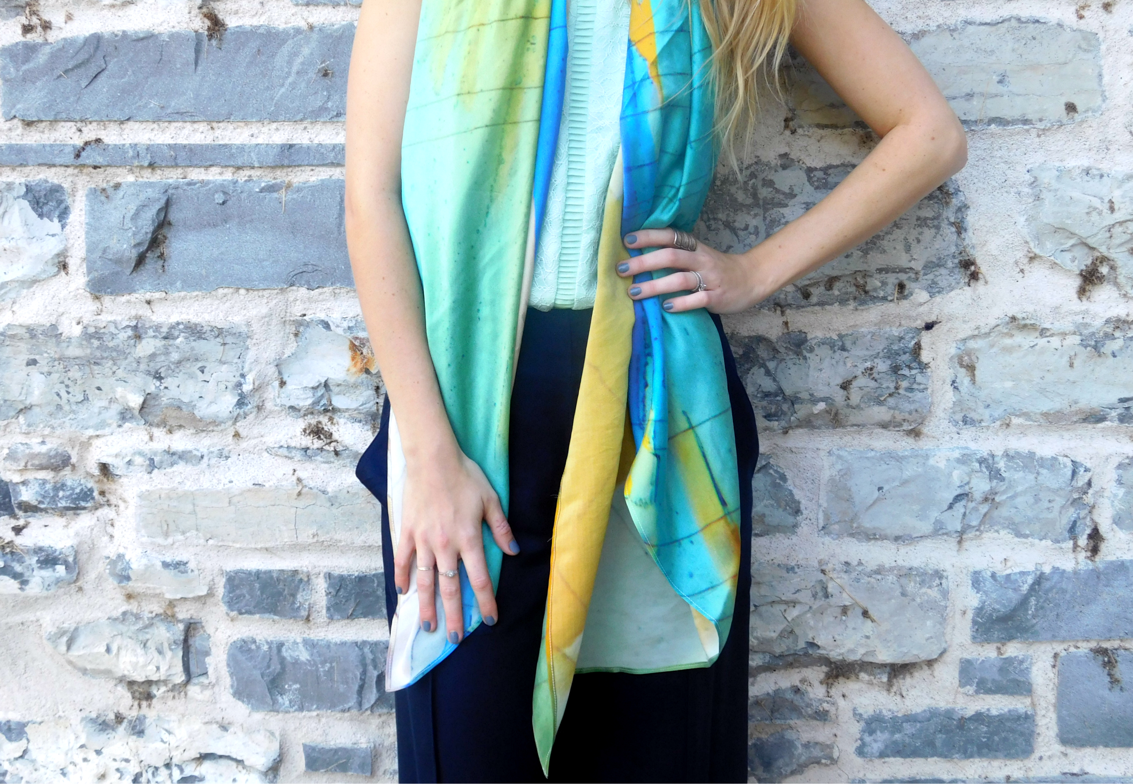 The green in this scarf is highlighted when paired with a coinciding colour top.