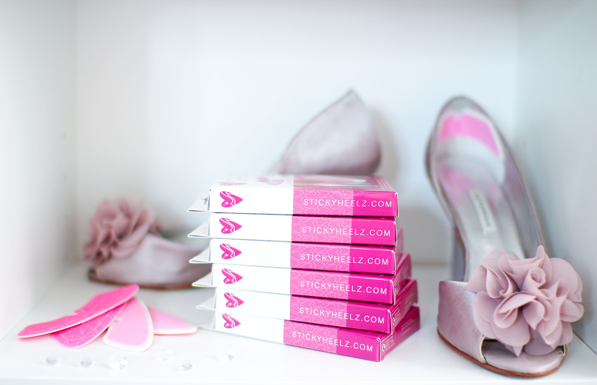 stickey heelz on shelf with high heel shoes