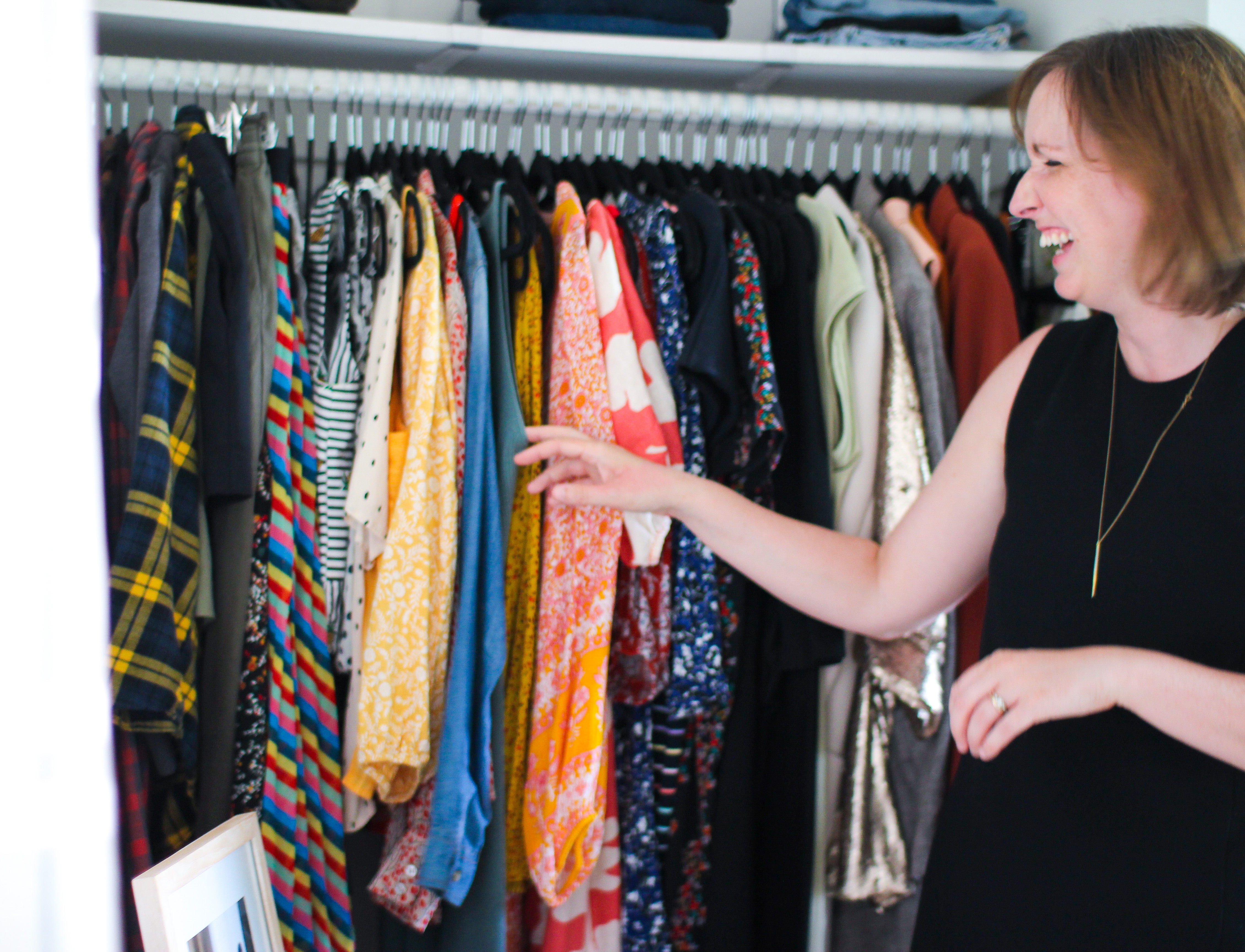 jocelyn of popped closet organizing in a closet