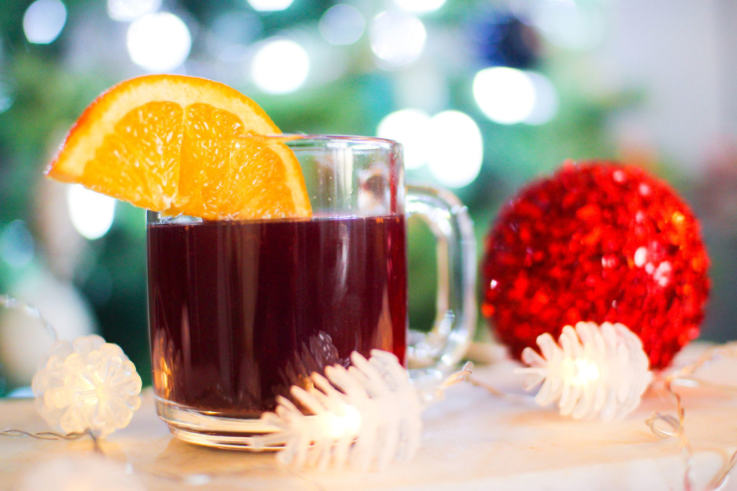 mulled wine in a mug with an orange slice