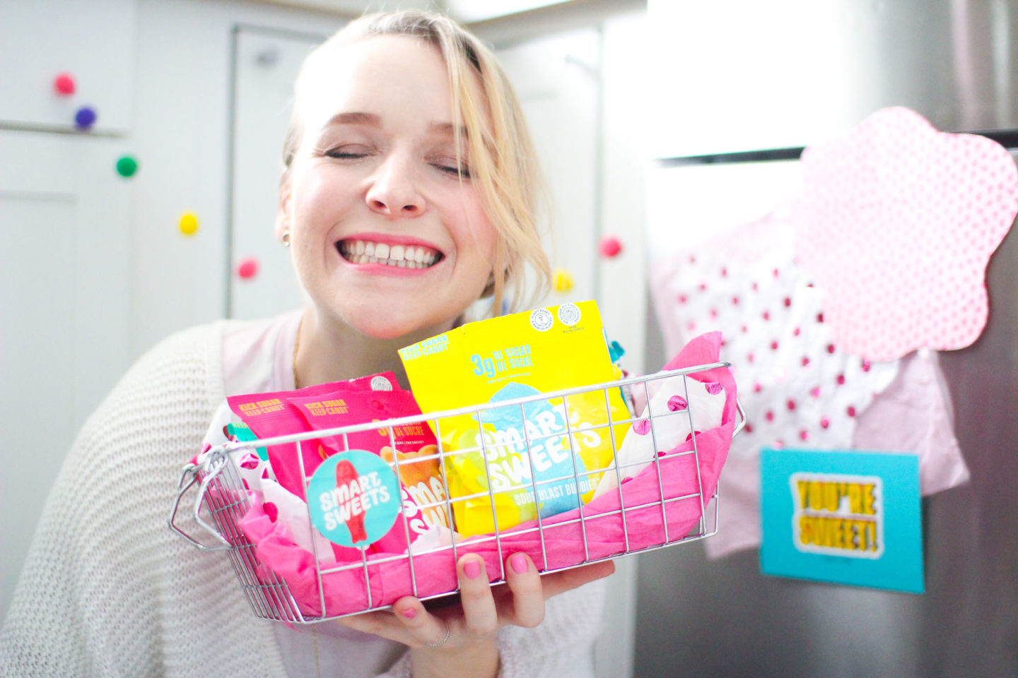 Influencer holding basket of smart sweets candy