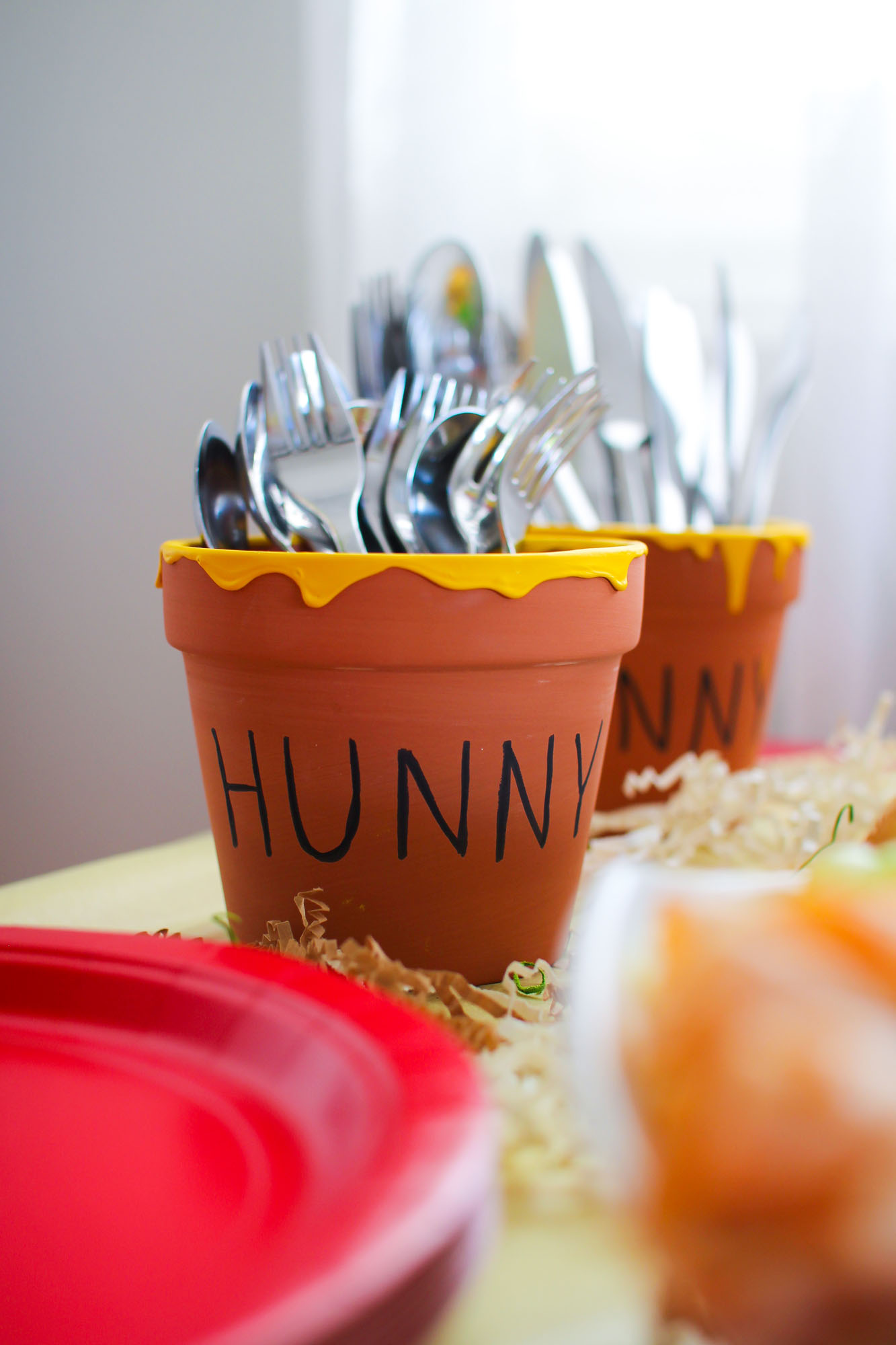 winnie the pooh birthday decorations DIY honey pots holding cutlery